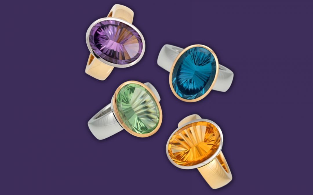 Vier Ringe aus der HOFACKER Collection Couleur aus feinstem Gold besetzt mit Farbedelsteinen im Spiegelschliff